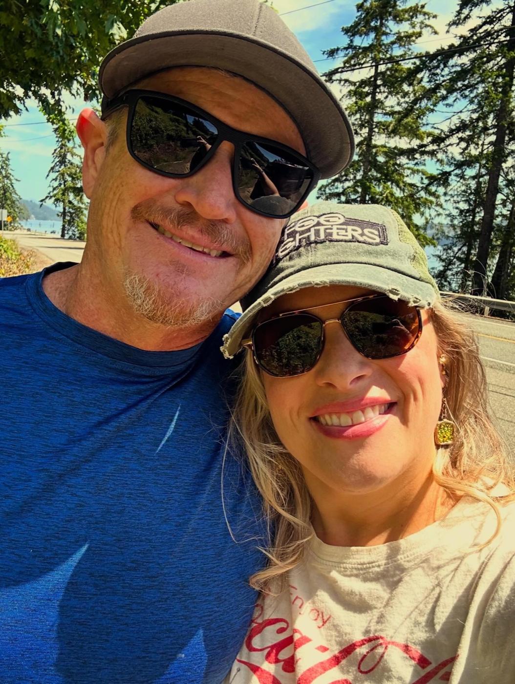 Andrea and her husband Clint smiling outdoors